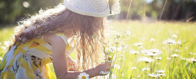 A woman with allergies in a field of flowers