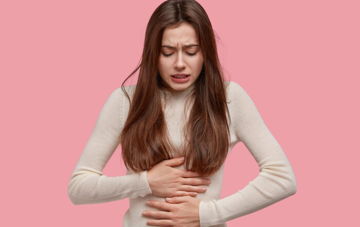 a woman with gerd and heartburn needing holistic support in Charleston, SC